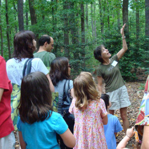 Genia Duchon, volunteer educator, leads a walk with local students