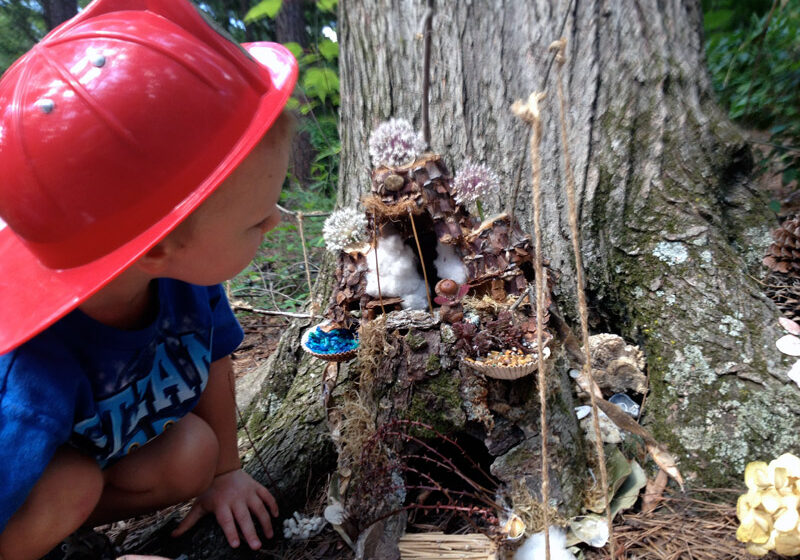 Woodlands-little-boy-with-fairy-garden